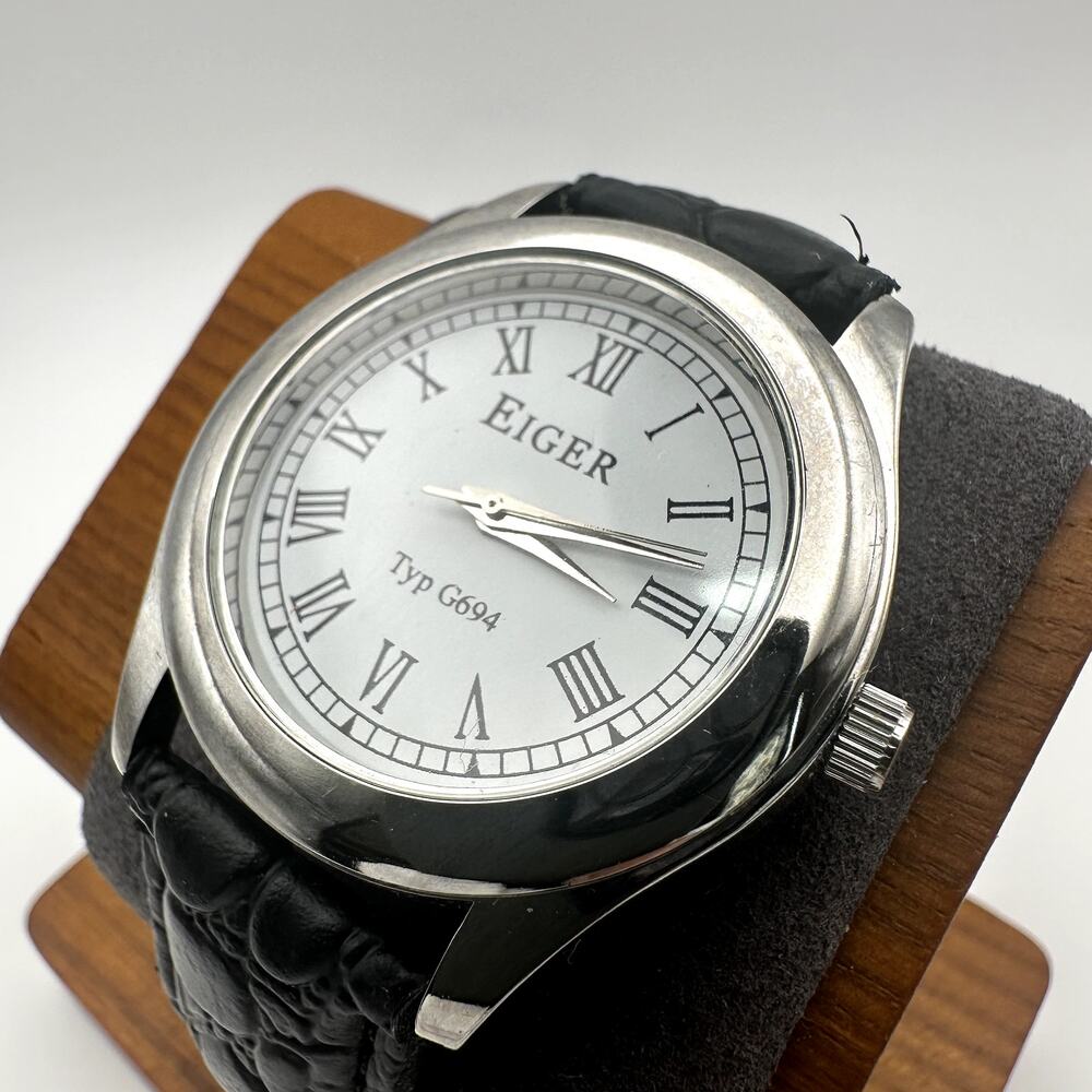 Eiger Typ G694 Silver Tone Quartz Watch White Dial Roman Numerals Black Strap